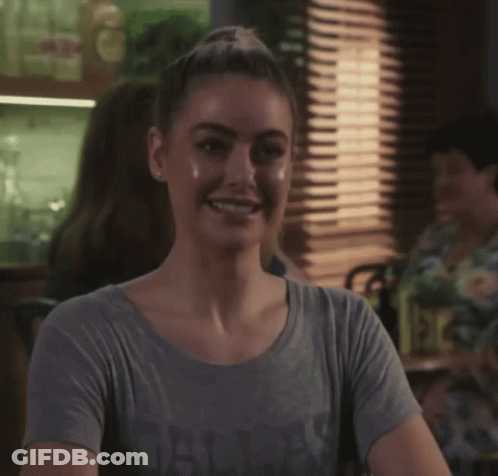 A Woman Wearing A Grey T-Shirt That Says Always Smiles GIF