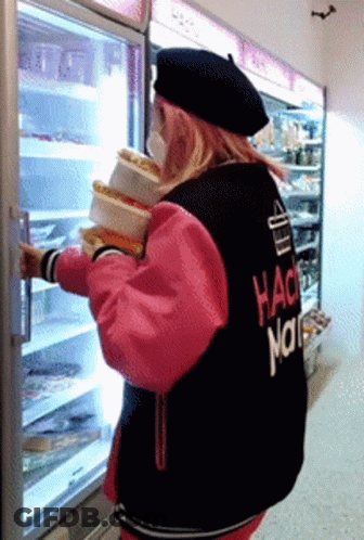 A Woman Wearing A Hack Nation Jacket Holds A Stack Of Food GIF