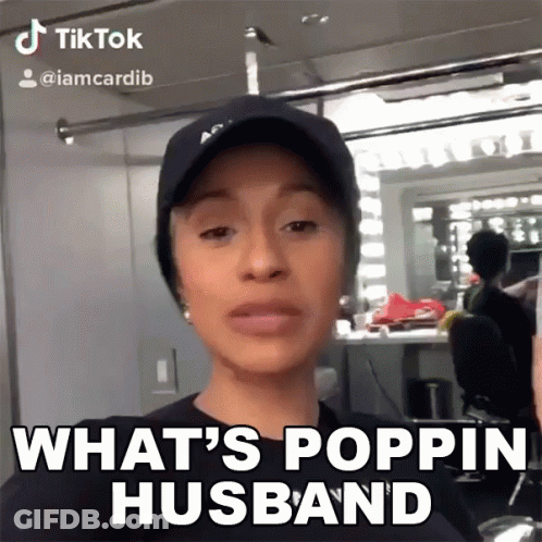 A Woman Wearing A Hat And A Black Shirt Says What 'S Poppin Husband GIF