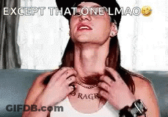 A Woman Wearing A Hat And A Necklace Is Sitting On A Couch And Scratching Her Neck . GIF