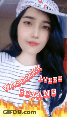 A Woman Wearing A Hat And A Striped Shirt With Ayee Goyang In Red Letters GIF