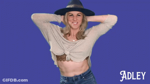 A Woman Wearing A Hat And A Sweater Is Named Adley GIF