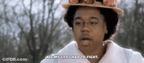 A Woman Wearing A Hat And A White Coat Is Talking About Her Life . GIF