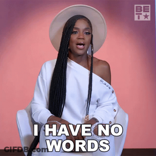 A Woman Wearing A Hat And A White Shirt Says I Have No Words GIF