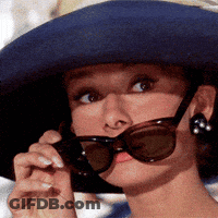 Woman Wearing Hat And Sunglasses Looking At Something GIF