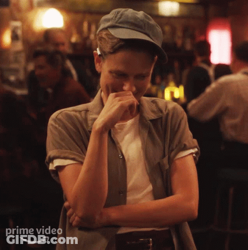 Woman Laughing In Bar With Prime Video Text GIF