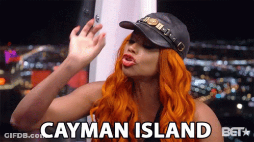 A Woman Wearing A Hat Says Cayman Island GIF