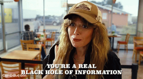A Woman Wearing A Hat Says " You 'Re A Real Black Hole Of Information " In A Restaurant GIF