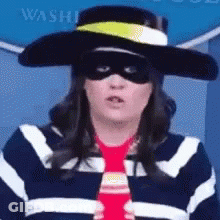 A Woman Wearing A Hat , Sunglasses , And A Tie . GIF