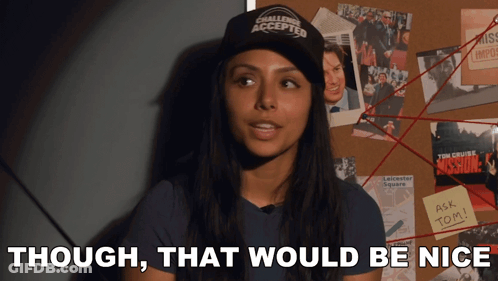 A Woman Wearing A Hat That Says Challenge Accepted Stands In Front Of A Bulletin Board GIF