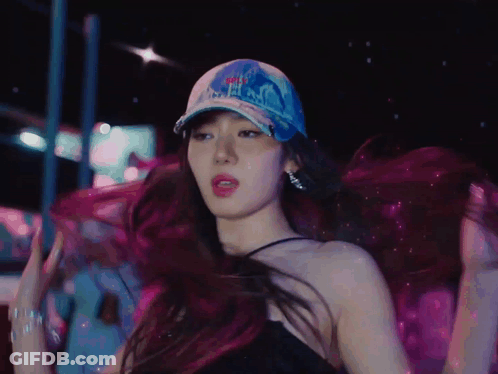 A Woman Wearing A Hat That Says ' NYC ' On It GIF