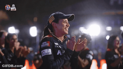 A Woman Wearing A Hat That Says Royal Challenge GIF