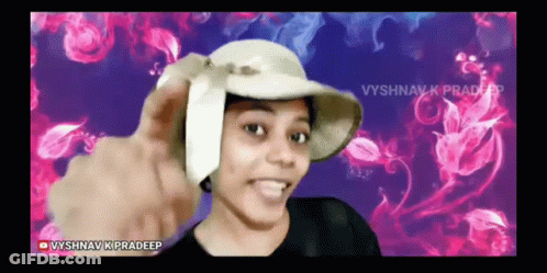 A Woman Wearing A Hat With The Name Vyshnav K Pradeep At The Bottom GIF