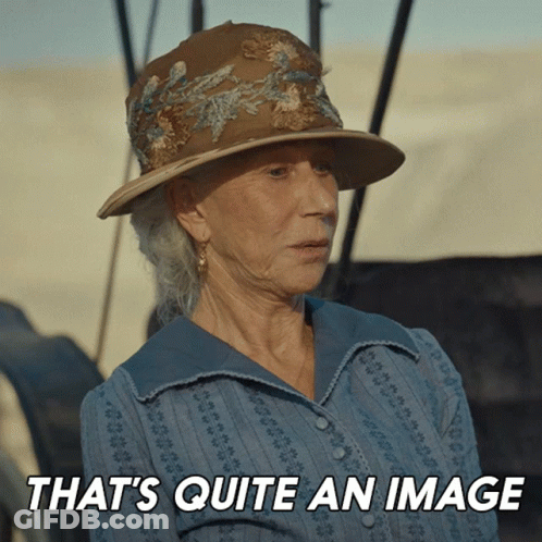 A Woman Wearing A Hat With The Words That 'S Quite An Image Behind Her GIF