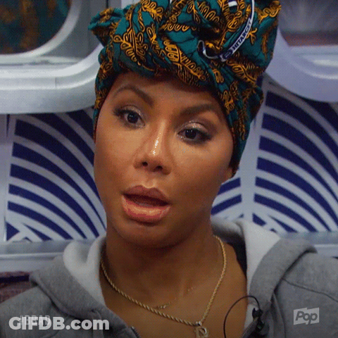 A Woman Wearing A Head Scarf And A Necklace With Pop Written On The Bottom GIF