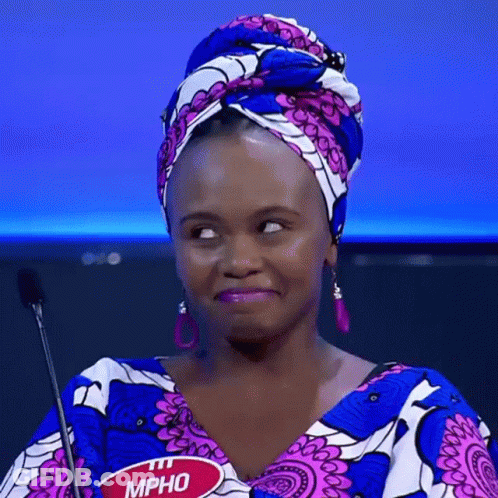 A Woman Wearing A Head Scarf And Earrings Has A Name Tag That Says Mpho GIF