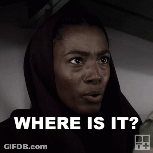 A Woman Wearing A Head Scarf Is Asking Where Is It GIF