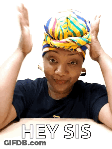 A Woman Wearing A Head Scarf Is Sitting At A Table And Says Hey Sis GIF
