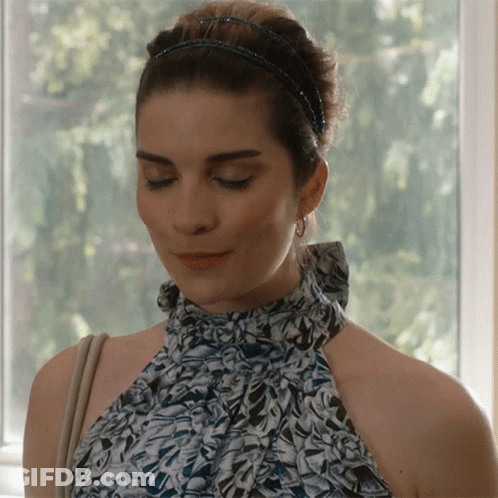 Woman Looking Down With Headband GIF