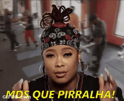 A Woman Wearing A Headband And Earrings Says Mds Que Pirralha . GIF