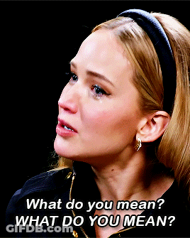 A Woman Wearing A Headband And Earrings Says What Do You Mean GIF