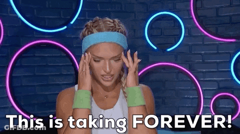 A Woman Wearing A Headband And Wristbands Is Holding Her Head And Says `` This Is Taking Forever ! '' GIF