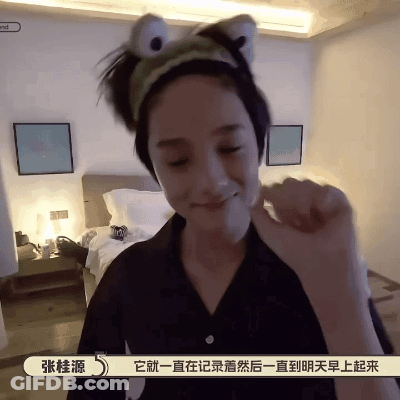 A Woman Wearing A Headband That Looks Like A Frog Is Making A Funny Face GIF