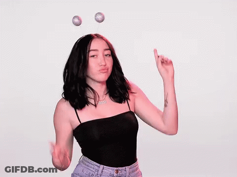 A Woman Wearing A Headband With Antennas On It Is Making A Middle Finger Sign . GIF