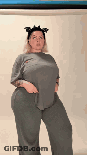 A Woman Wearing A Headband With Bats On It GIF