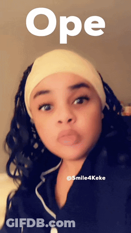 A Woman Wearing A Headband With The Word Ope Written Above Her GIF
