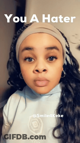 A Woman Wearing A Headband With The Words You A Hater Above Her GIF