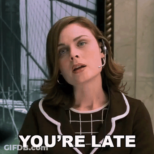 A Woman Wearing A Headset With The Words You 'Re Late Below Her GIF