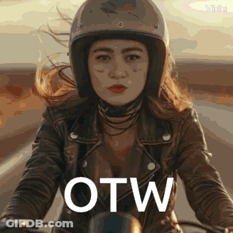 A Woman Wearing A Helmet And A Leather Jacket Is Riding A Motorcycle With The Word Otw Written On The Front GIF