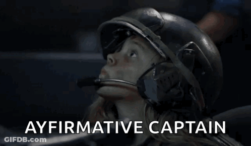 A Woman Wearing A Helmet With The Words Ayfirmative Captain Written Above Her GIF