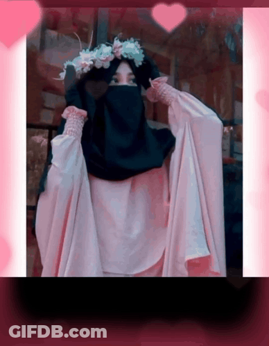 A Woman Wearing A Hijab And A Flower Crown GIF
