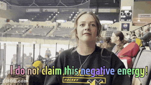 A Woman Wearing A Hockey Shirt Says " I Do Not Claim This Negative Energy ! " GIF