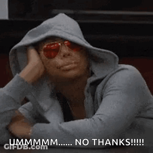 A Woman Wearing A Hoodie And Sunglasses Is Sitting At A Table With Her Head On Her Hand . GIF
