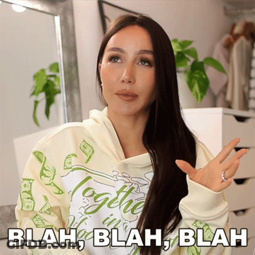 A Woman Wearing A Hoodie That Says Blah Blah Blah On It GIF