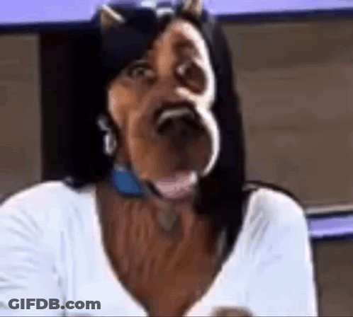 A Woman Wearing A Horse Mask With Horns On Her Head . GIF