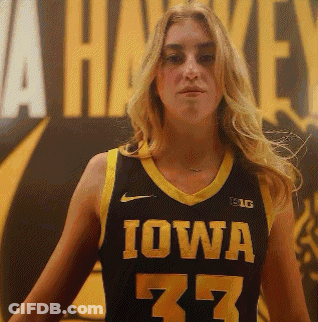 A Woman Wearing A Iowa Jersey Number 77 GIF