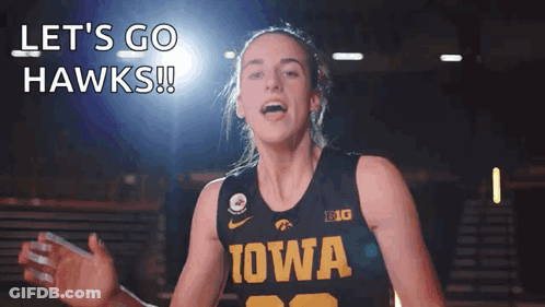 A Woman Wearing A Iowa Jersey Says Let 'S Go Hawks ! GIF