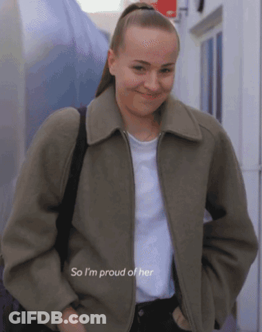 A Woman Wearing A Jacket And A White Shirt Says " So I 'M Proud Of Her " GIF