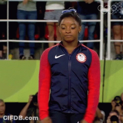 A Woman Wearing A Jacket That Says ' Usa ' On It GIF