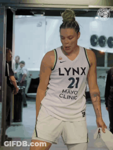 A Woman Wearing A Jersey That Says Lynx Mayo Clinic GIF