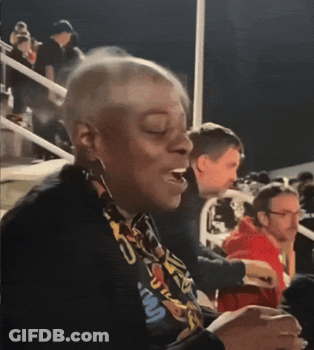 A Woman Wearing A Lanyard That Says ' U.s.a. ' On It GIF