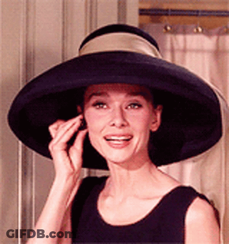 Woman In Large Black Hat Smiling GIF
