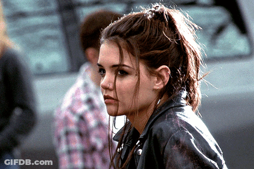 A Woman Wearing A Leather Jacket And A Ponytail GIF