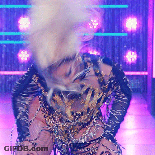 Woman In Leopard Print Dancing On Stage GIF