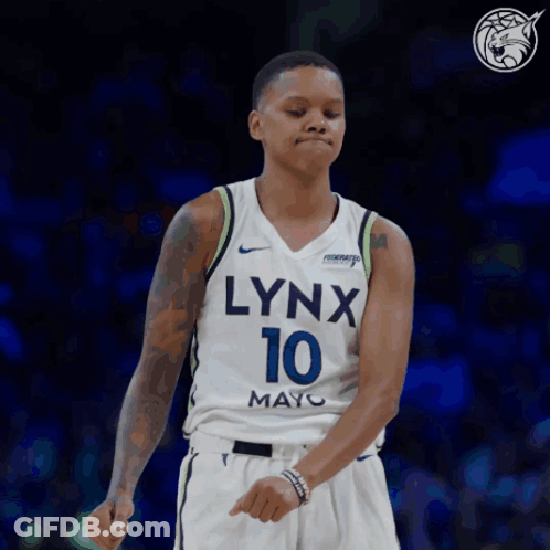 A Woman Wearing A Lynx 10 Jersey Is Dancing GIF
