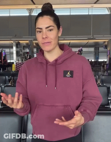 A Woman Wearing A Maroon Air Jordan Hoodie Is Talking GIF